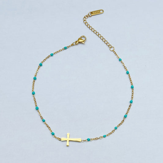 Fußkette mit Kreuz und blauen Kugeln