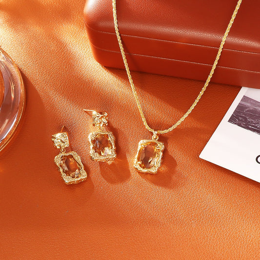 GLANZI Halskette & Ohrringe - Transparenter Kristall im Merlot-Stil